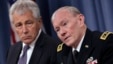 U.S. Secretary of Defense Chuck Hagel (L) and Joint Chiefs of Staff General Martin Dempsey hold a joint news conference at the Pentagon in Washington, March 17, 2013.