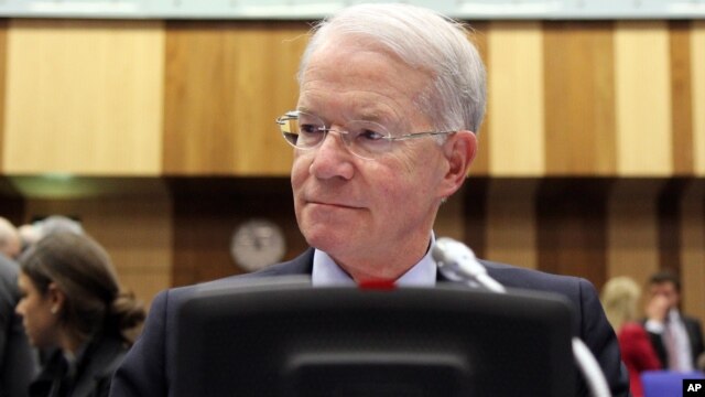 Joseph E. Macmanus, Permanent U.S. Representative to the United Nations, waits for the start of the IAEA board of governors meeting at the International Center in Vienna, Austria, March 6, 2013.