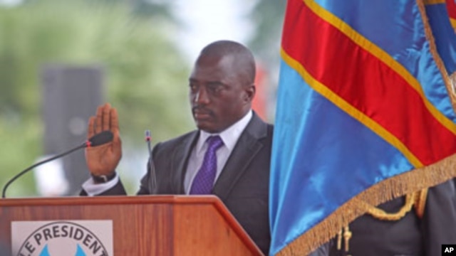 Congo President Joseph Kabila, center left, stands during his swearing-in ceremony for another term, in Kinshasa, Dec. 20, 2011.