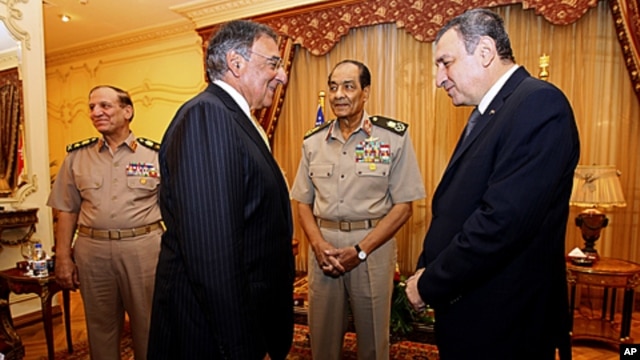 Defense Secretary Leon Panetta meets with Egyptian Field Marshal Mohamed Hussein Tantawi, second from right, and Egyptian Prime Minister Essam Sharaf at the Financial Authority House in Cairo, Egypt, October 4, 2011.