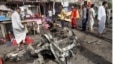 Civilians gather at the site of a car bomb attack in front of a crowded popular restaurant in Basra, 340 miles (550 kilometers) southeast of Baghdad, Iraq, May 20, 2013.
