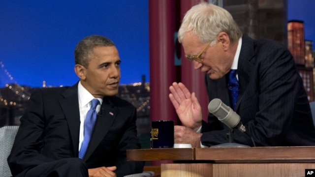 President Barack Obama talks with David Letterman on the set of the "Late Show With David Letterman" in New York, Sept. 18, 2012.  