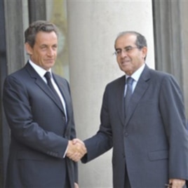 France's President Nicolas Sarkozy, left, greets the head of Libya's opposition government Mahmoud Jibril at the Elysee Palace in Paris, August 24, 2011.