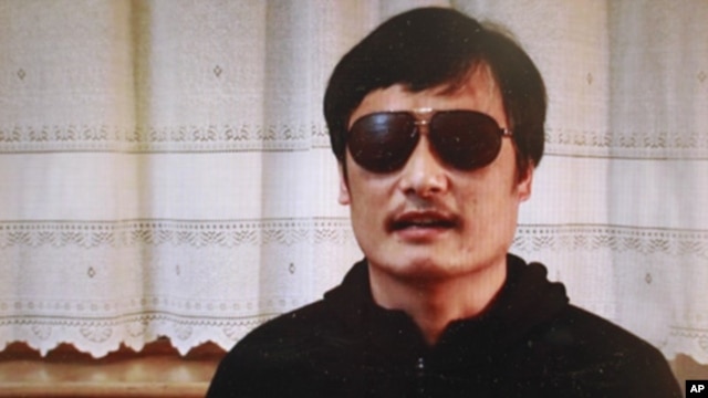 In this image made from video, blind legal activist Chen Guangcheng is seen on a video posted to YouTube Friday, April 27, 2012.