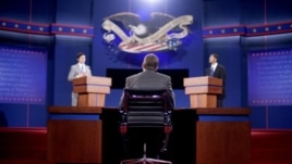 Stand-ins for moderator Jim Lehrer (C), Republican presidential candidate, former Massachusetts Governor Mitt Romney (L) and President Barack Obama (R), run through a rehearsal for the first presidential debate on Wednesday at the University of Denver, in