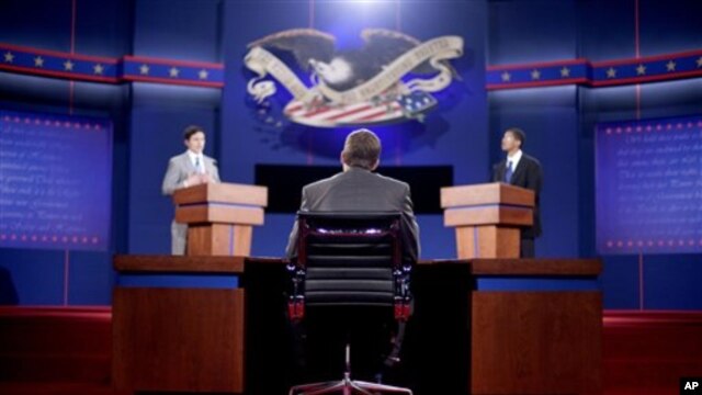 Stand-ins for moderator Jim Lehrer (C), Republican presidential candidate, former Massachusetts Governor Mitt Romney (L) and President Barack Obama (R), run through a rehearsal for the first presidential debate on Wednesday at the University of Denver, in