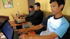 Cambodian men are using internet at a coffee shop in Phnom Penh, file photo. 