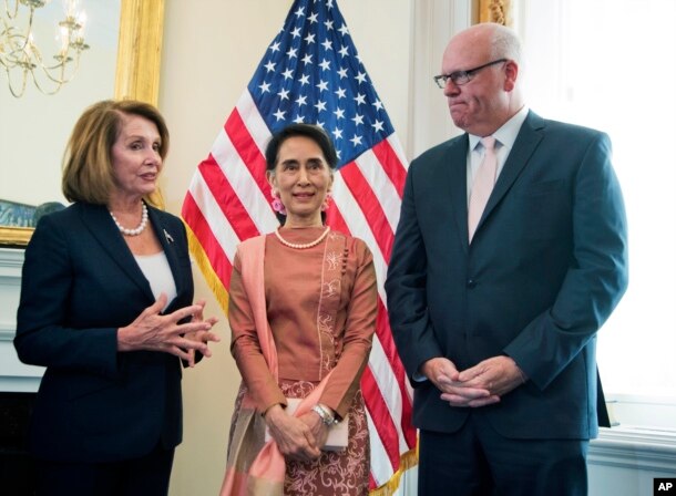 FILE - Myanmar leader Aung San Suu Kyi, center, meets House Minority Leader Nancy Pelosi of Calif.. and Rep. Joseph Crowley, D-N.Y., on Capitol Hill in Washington, Sept. 15, 2016.