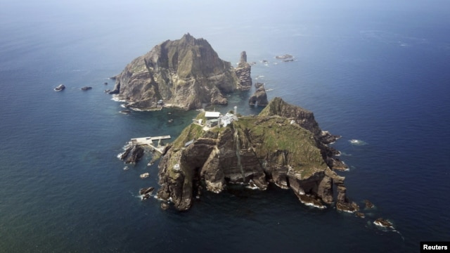 A set of remote islands called Dokdo in Korean and Takeshima in Japanese is seen in this picture taken from a helicopter August 10, 2012. 