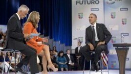 President Barack Obama participates in a town hall hosted by Univision and Univision news anchors Jorge Ramos (L) and Maria Elena Salinas (C), at the University of Miami, Florida, September 20, 2012.