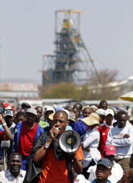 A mineworker addresses his colleagues before taking part in a march outside the Anglo American mine in South Africa's North West Province, September 12, 2012.