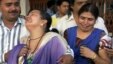 Unidentified relatives of an injured of a rebel attack cry outside a government hospital in Raipur, India, May 25, 2013.