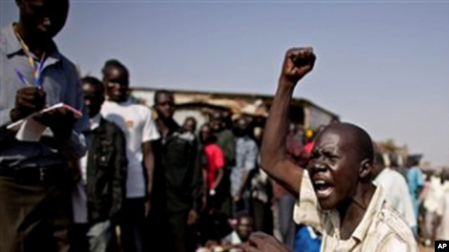 A southern Sudanese man chants pro-independence slogans outside a polling station in the southern capital of Juba Sunday, Jan. 9, 2011