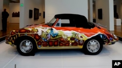 FILE - 1965 Porsche Type 356 C Cabriolet that once belonged to Janis Joplin on display in the "Porsche By Design Seducing Speed" exhibit at the North Carolina Museum of Art in Raleigh, North Carolina.