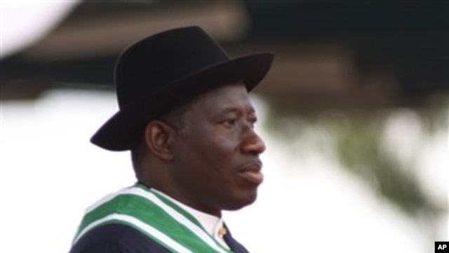 Nigeria President Goodluck Jonathan watches Nigeria troops parade during his inauguration ceremony at the main parade ground in Nigeria's capital of Abuja, May 29, 2011