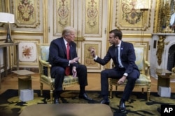 El presidente de EE.UU., Donald Trump y el presidente de Francia, Emmanuel Macron, reunidos en el Palacio del Eliseo, en París, Francia, el sábado 10 de noviembre de 2018.