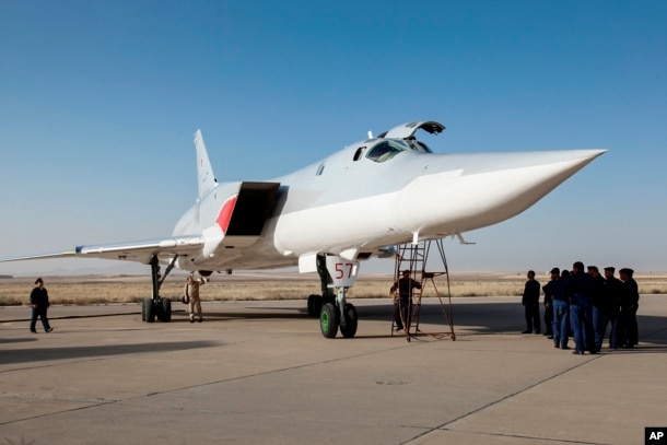 FILE - A Russian Tu-22M3 stands on the tarmac at an air base near Hamedan, Iran, Aug. 15, 2016. Russian warplanes used the base to target Islamic State fighters and other militants in Syria.