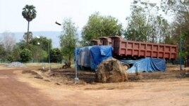 Trucks are seen in the compound of the Cambodia Iron Group at the Rovieng District in Preah Vihear province, February 10, 2013.