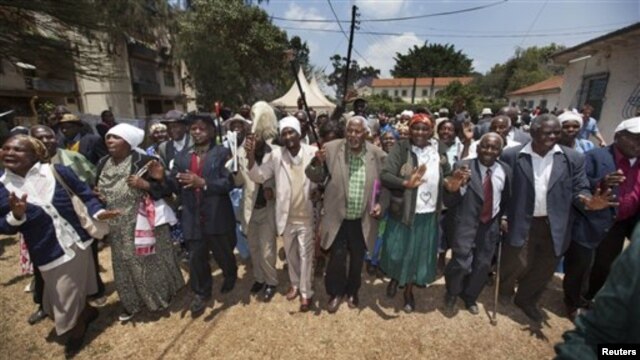 Kenyan Mau Mau War veterans and their supporters celebrate the announcement of a legal decision in Britain's High Court concerning Mau Mau veterans in Nairobi, Kenya, October 5, 2012.