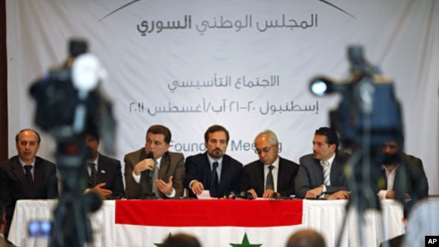 Members of Syrian oppositions (L-R) Ahmed Ramadan, Khaled Hassaleh, Hassan Hashmi, Lovay Safi, Abdul Basit Sida, Adip Shishakil, Hassan Shalabi attend a news conference after meeting in Istanbul, August 23, 2011