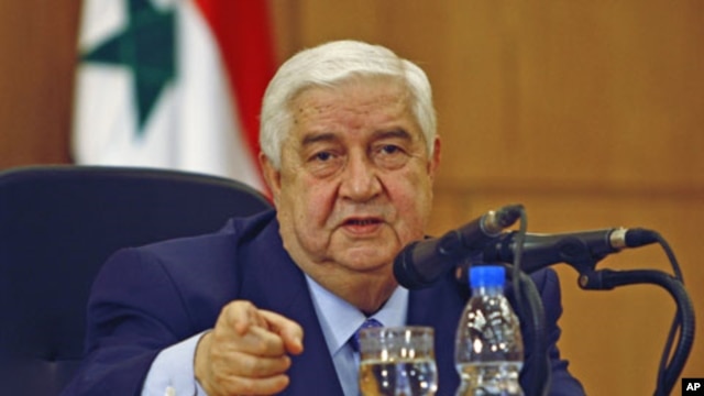 Syrian Foreign Minister Walid al-Moualem talks during a news conference in Damascus, Syria, January 24, 2012.