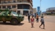 An armoured vehicle of of the Congolese army, part of the Central African Multinational Force is parked in front of a bank in central Bangui on April 3, 2013.  
