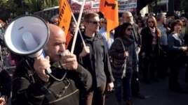 Public sector employees demonstrate in central Athens on November 13, 2012 against expected layoffs
