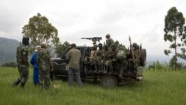 Congolese government soldiers prepare to drive from a military outpost between Kachiru village and Mbuzi hill, in eastern Democratic Republic of the Congo, May 25, 2012.