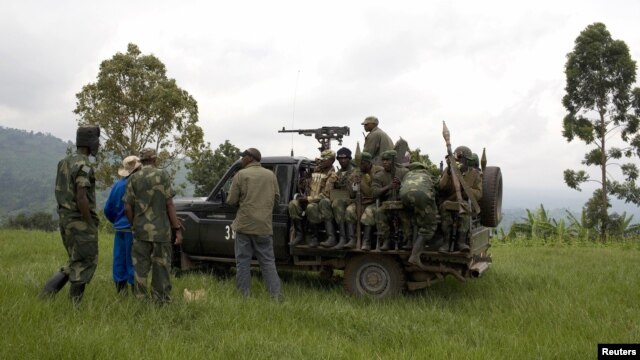 Congolese government soldiers prepare to drive from a military outpost between Kachiru village and Mbuzi hill, in eastern Democratic Republic of the Congo, May 25, 2012.