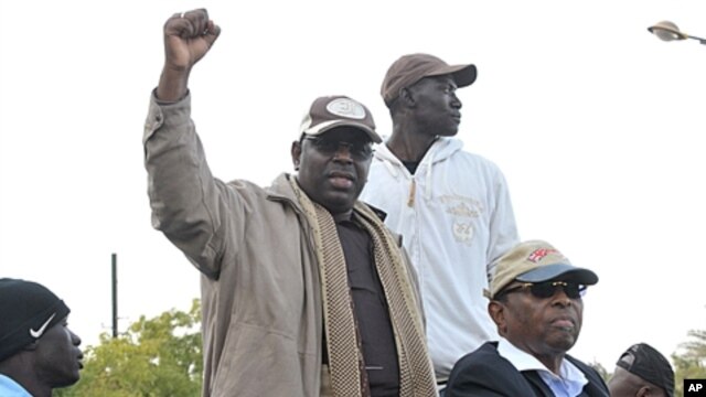 Senegalese opposition leader Macky Sall gestures as he attends a demonstration demanding that President Abdoulaye Wade drop plans to seek a third term in Dakar, Senegal, January 31, 2012.