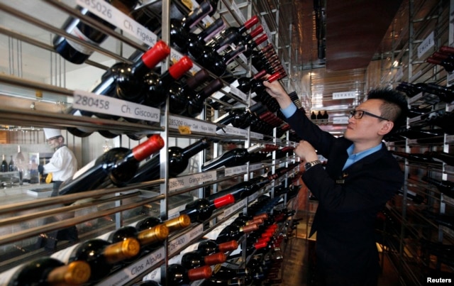 A manager looks at wines at the Marco Polo restaurant at the Grand Intercontinental Hotel in the Gangnam area of Seoul, South Korea, Oct. 2, 2012.