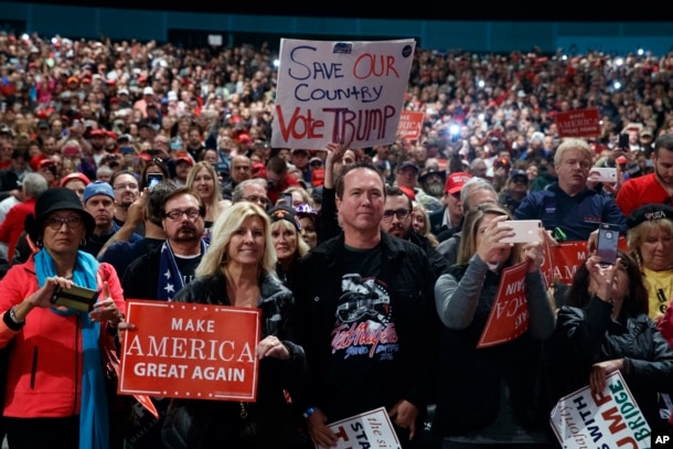 Supporters of Republican presidential candidate Donald Trump speaks during a campaign rally, Nov. 6, 2016, in Sterling Heights, Mich.
