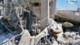 A Syrian man checks his destroyed house that was damaged by a Syrian forces air strike in the town of Qusair.