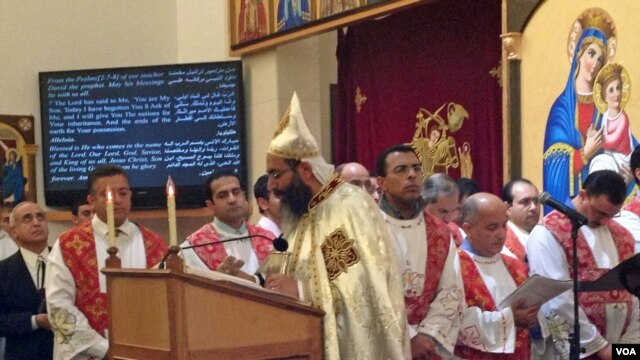 Father Bishoy Andrawes leads a Christmas celebration at the St. Mark Orthodox Church in Fairfax, Virginia on January 6, 2013. (Mohamed Elshinnawi)