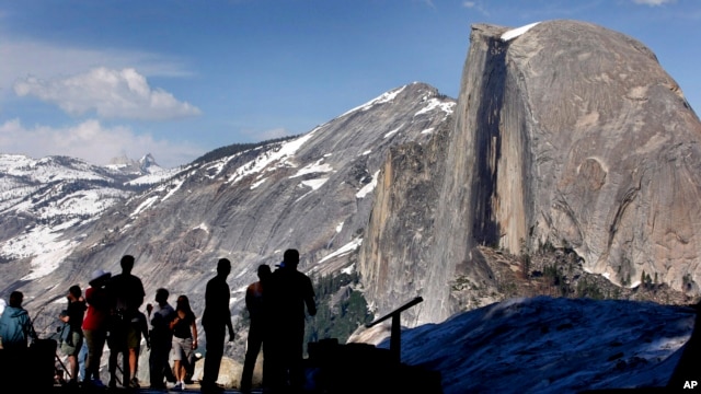 In this 2005 file photo, visitors view Half Dome from Glacier Point at Yosemite National Park, Calif. (AP Photo) 
