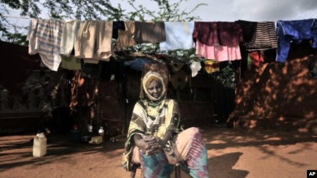 Suban Abdi, who claims one of her sons was recruited into mercenary forces trained by the Kenyan army, sits in a refugee camp, in Dadaab, eastern Kenya. (file photo)