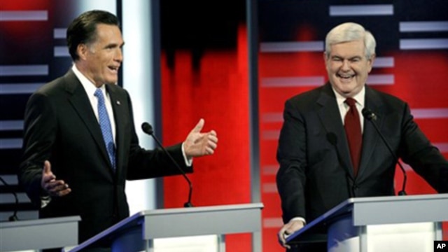 U.S. Republican presidential candidates Mitt Romney, left, and Newt Gingrich, Des Moines, Iowa, Dec. 10, 2011.