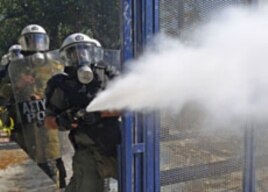 Riot police spray tear gas at demonstrators during clashes in Athens' Syntagma [Constitution] square, October 19, 2011.
