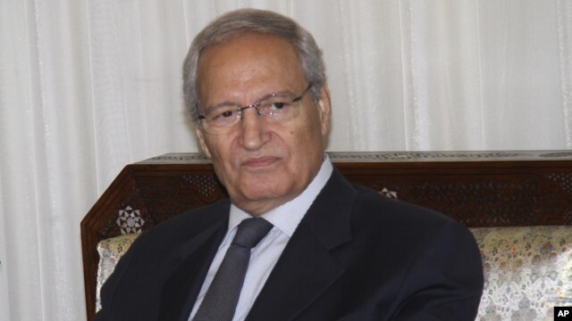Syrian Vice President Farouk Al-Sharaa, meets in Damascus, Syria with Alaeddin Boroujerdi, not shown, the head of Iran's powerful parliamentary committee on national security and foreign policy ending rumors that Al-Sharaa had defected to Jordan, August  