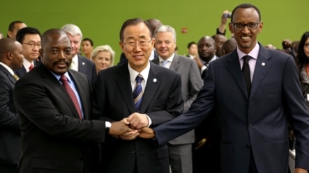 United Nations Secretary-General Ban Ki-moon, center, joins hands with President of the Democratic Congo Joseph Kabila Kabange, left, and President of Rwanda Paul Kagame at the 67th session of the General Assembly at United Nations Headquarters, Sept. 27,