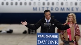 U.S. Republican presidential nominee Mitt Romney and his wife Ann arrive at a campaign rally in Newington, New Hampshire, November 3, 2012.