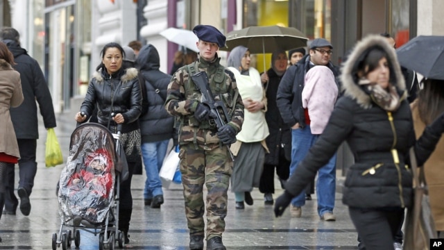 A French army soldier patrols down the Champs Elysee in Paris, January 15, 2013. 