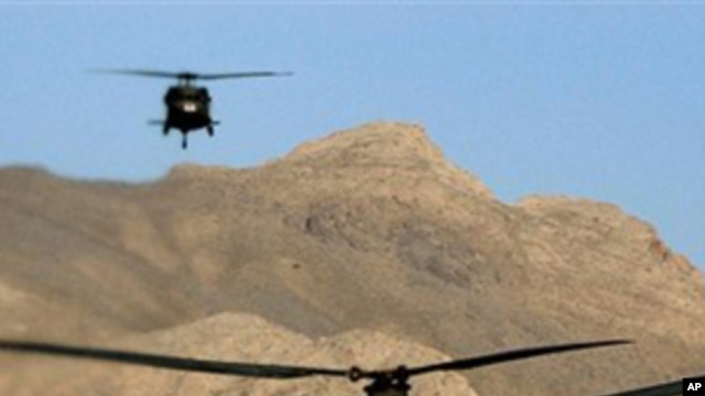 Chinook helicopters fly over the Paktia province near Khost, about 200 kilometers southeast of Kabul, Afghanistan, in this March 27, 2004, file photo.