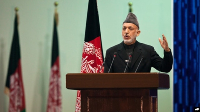 Afghan President Hamid Karzai speaks as he inaugurates Loya Jirga, grand assembly in Kabul,  November 16, 2011.