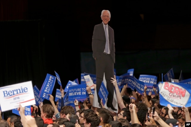 Supporters display a cardboard cutout of Democratic presidential candidate, Sen. Bernie Sanders, I-Vt., at a campaign rally in Miami, Florida, March 8, 2016.