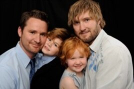 Stay-at-home dad Blake Humphreys (R) with his partner Paul Larsen (L) and their two children Aiden and Camille.