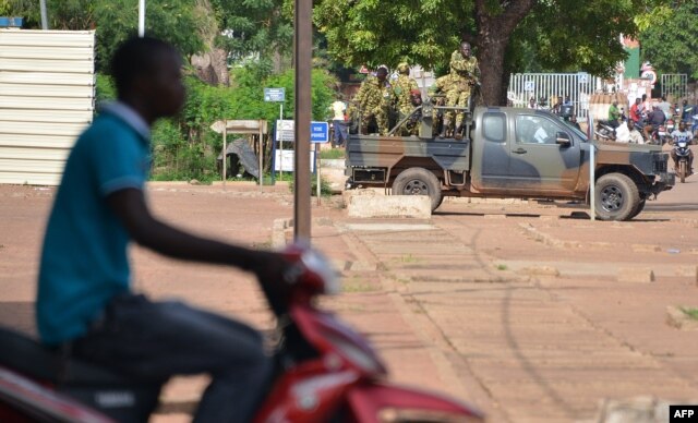 Burkina Faso's troops patroll in Ouagadougou on Sept. 17, 2015.