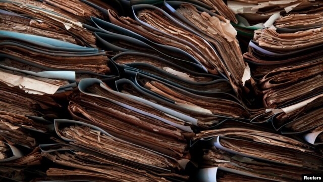 South Sudan's archives, including photographs, documents, books, and papers are seen inside a tent in the capital Juba, May 18, 2012. 