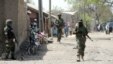 Nigerian soldiers are seen patrolling a town in the north-eastern state of Borno in this April 30, 2013, file photo.