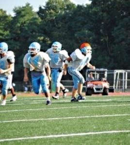 Rakin Hamad (middle, number 58) fasted during the last three football seasons but decided not to this year due to the extreme heat.
